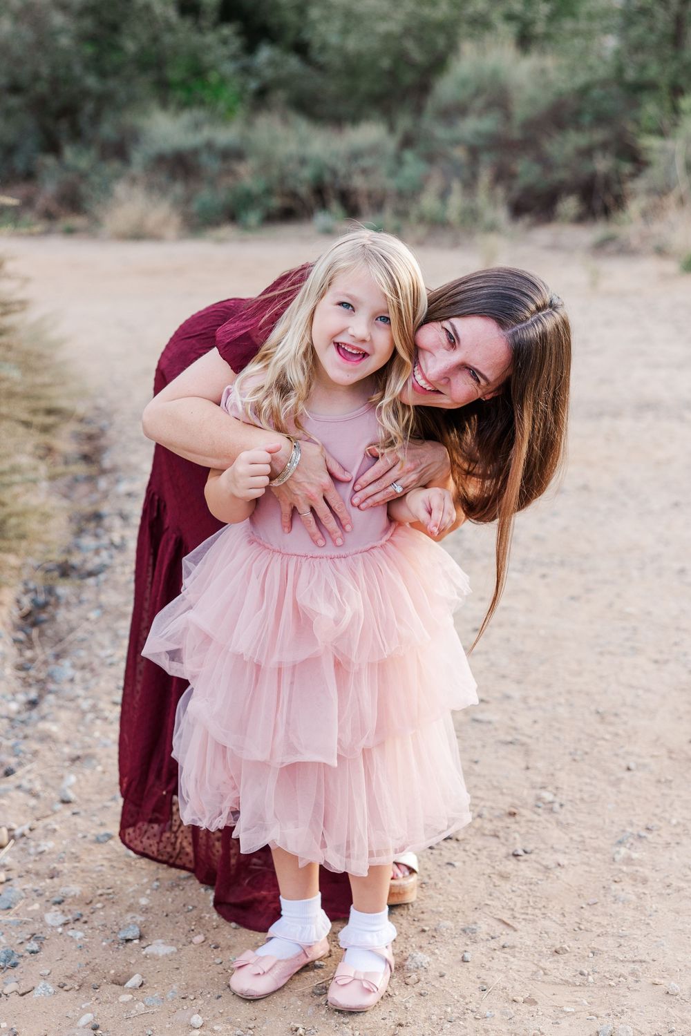 Outdoor family photos with green hills in Ventura County