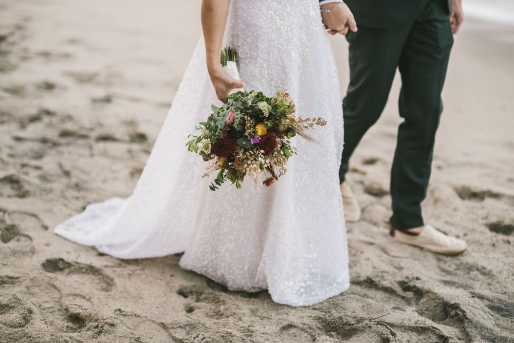 Newlyweds feet on a Colombian beach.