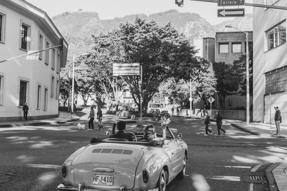 Black and white montage of urban street scenes showing parked cars and buildings in a residential area.