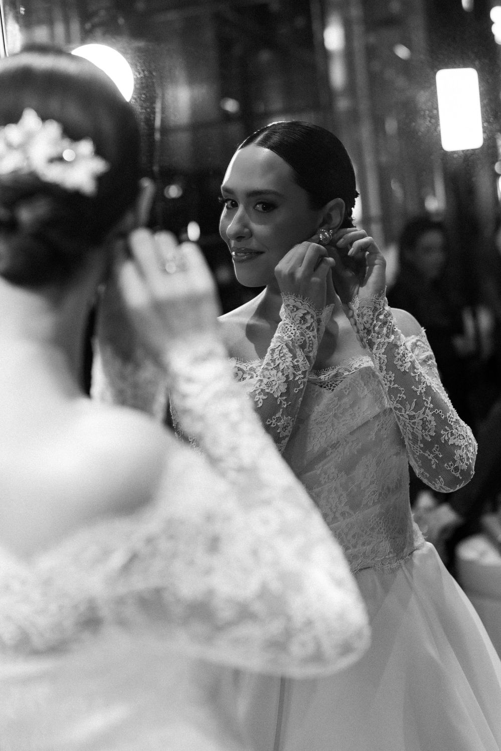 A black and white portrait series showing an elegant lace wedding dress with delicate details.