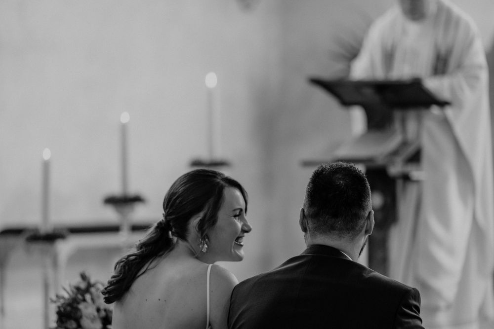 Black and white photograph of wedding ceremony moments in church setting.