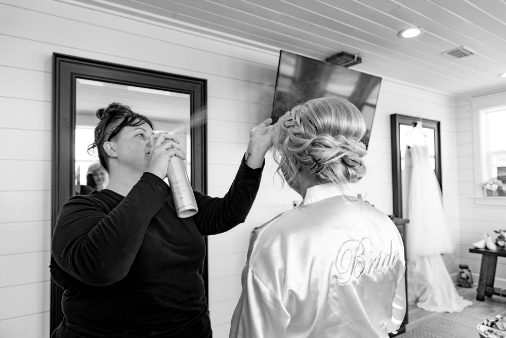 A black and white collage of wedding preparation moments showing hands, flowers, and dress details.