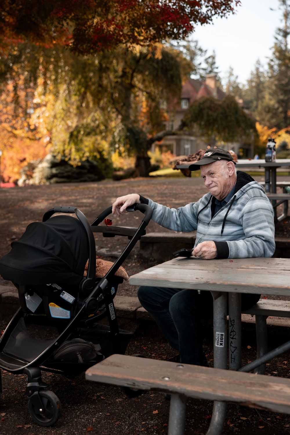 A sequence of photos showing someone resting their head on an outdoor picnic table on an autumn day.