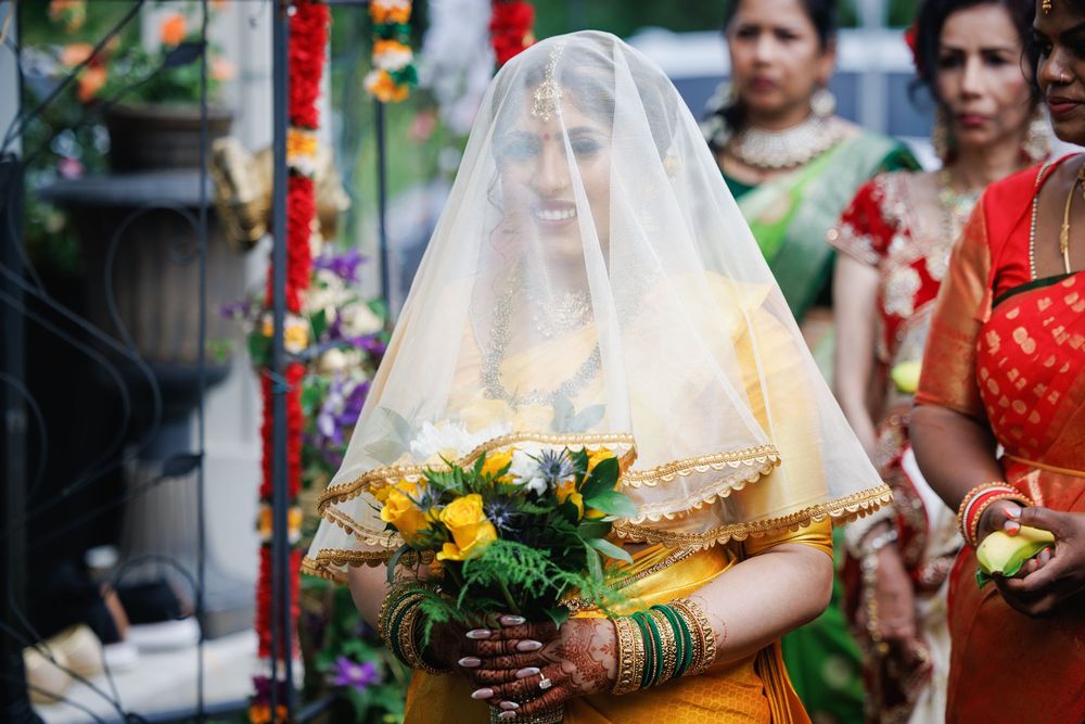 Close-up details of traditional Indian wedding ceremony with red and gold decorations.