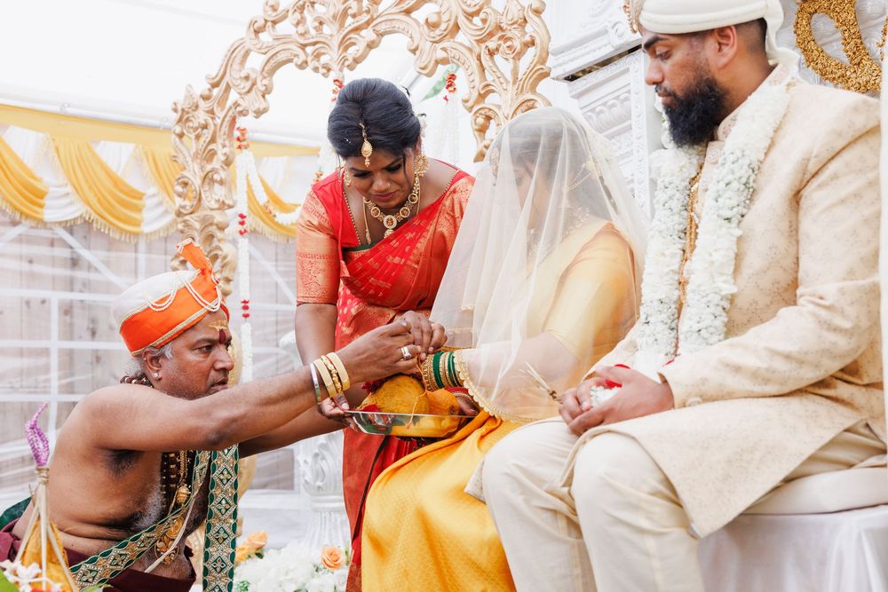 Wedding ceremony rituals with traditional Indian dress and decorative elements.