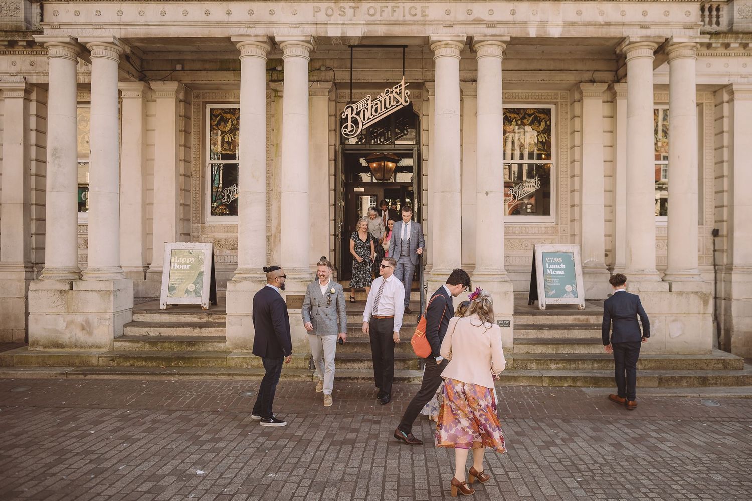 Guests gather outside The Botanist and head towards Ipswich Town Hall