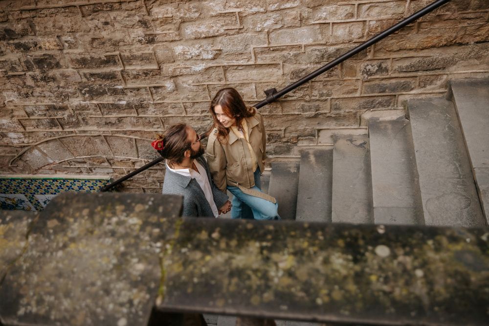 Natural portrait of the couple laughing mid-conversation.