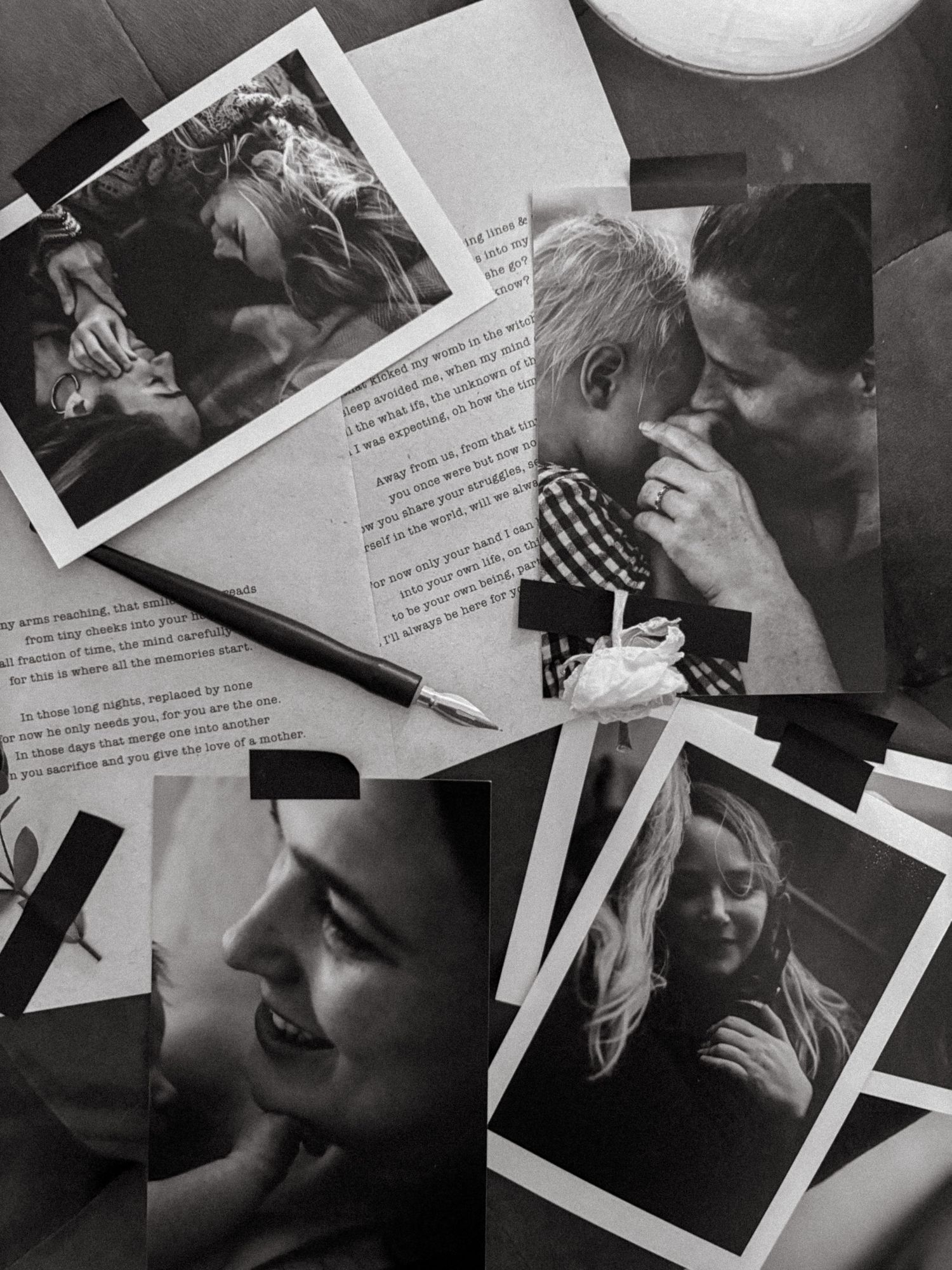 stack of black and white photos lying on bench next to white box during photo exhibition for a family photographer in Stockholm