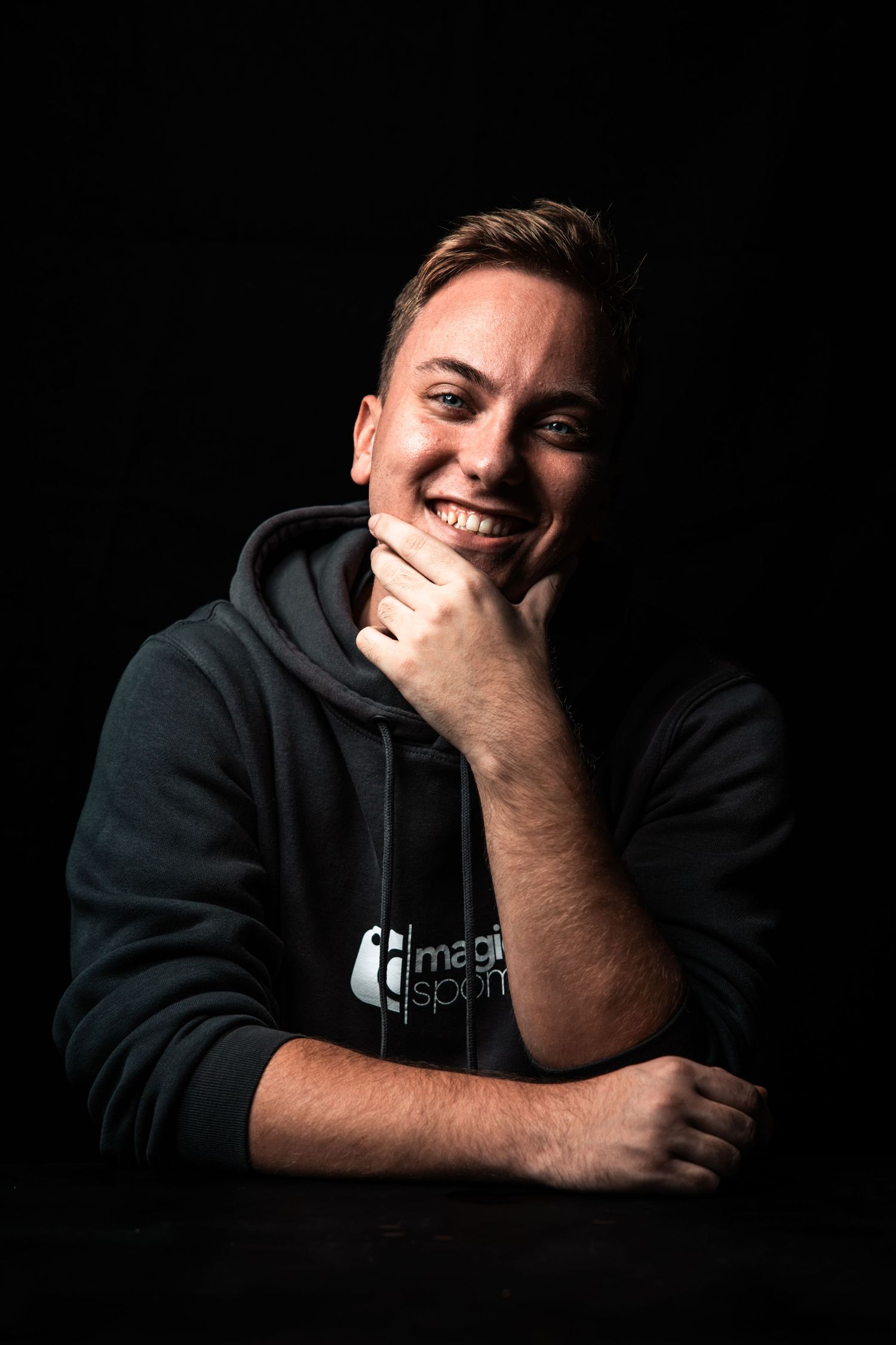 Artistic digital portrait of youthful person in blue shirt with styled hair.