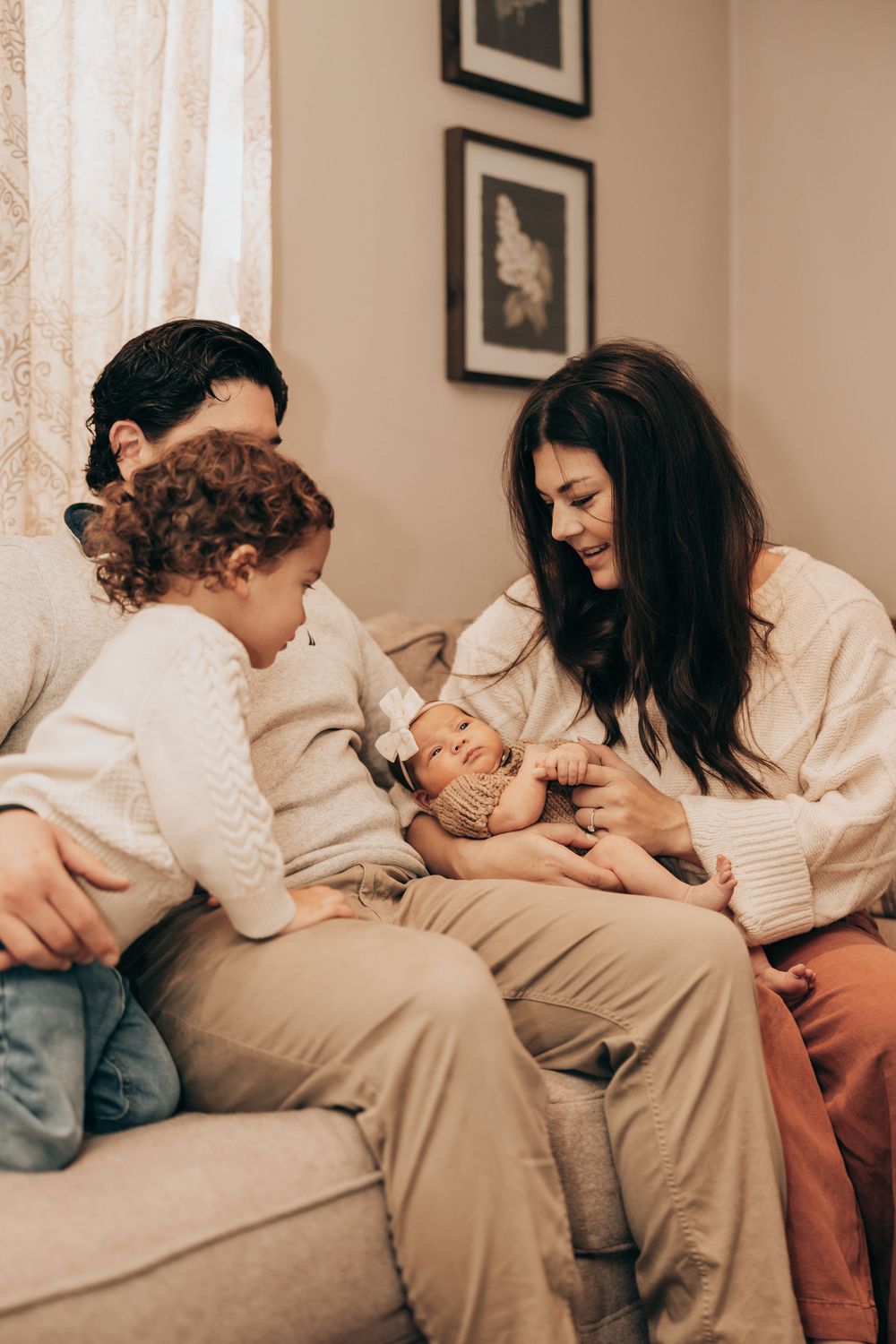 A sequence of photos showing a tender moment between parent and child lounging on a couch in warm lighting.