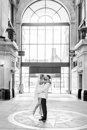 Bride and groom admiring the architecture inside the Council House, Nottingham, during their city elopement wedding.
