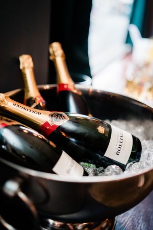Detail shot of champagne bottles chilled in ice at Table 47 reception in Nottingham city centre.