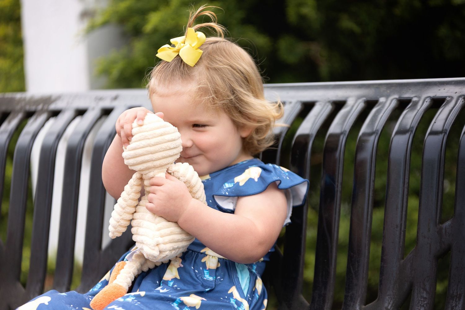A two-year-old little girl with curls looking at duck. Greenville, SC newborn photographer. Easley, SC Newborn photographer