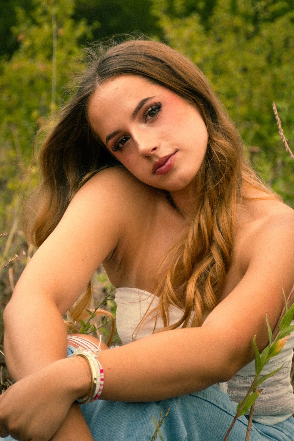 Artistic portrait series featuring soft lighting and natural outdoor scenery with warm golden tones.