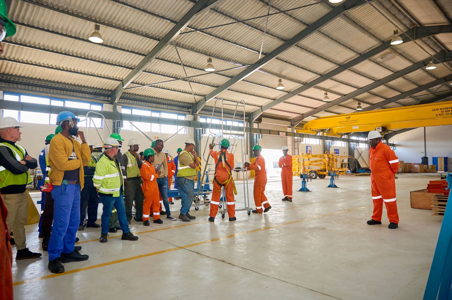 A group of people in a warehouse