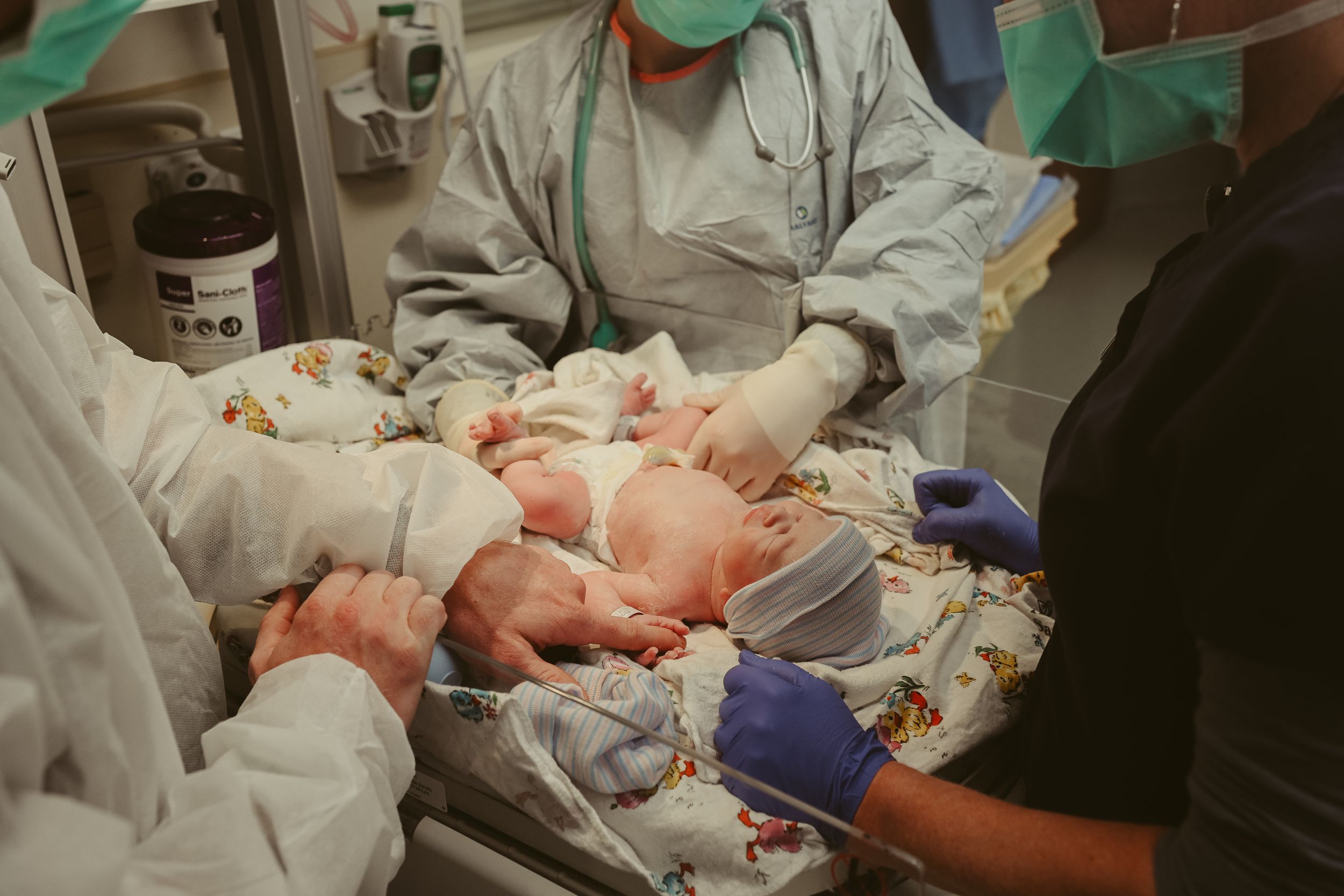 Baby girl is checked out by nurses in the operating room post cesarean section at St. Thomas in Nashville, Tennessee.