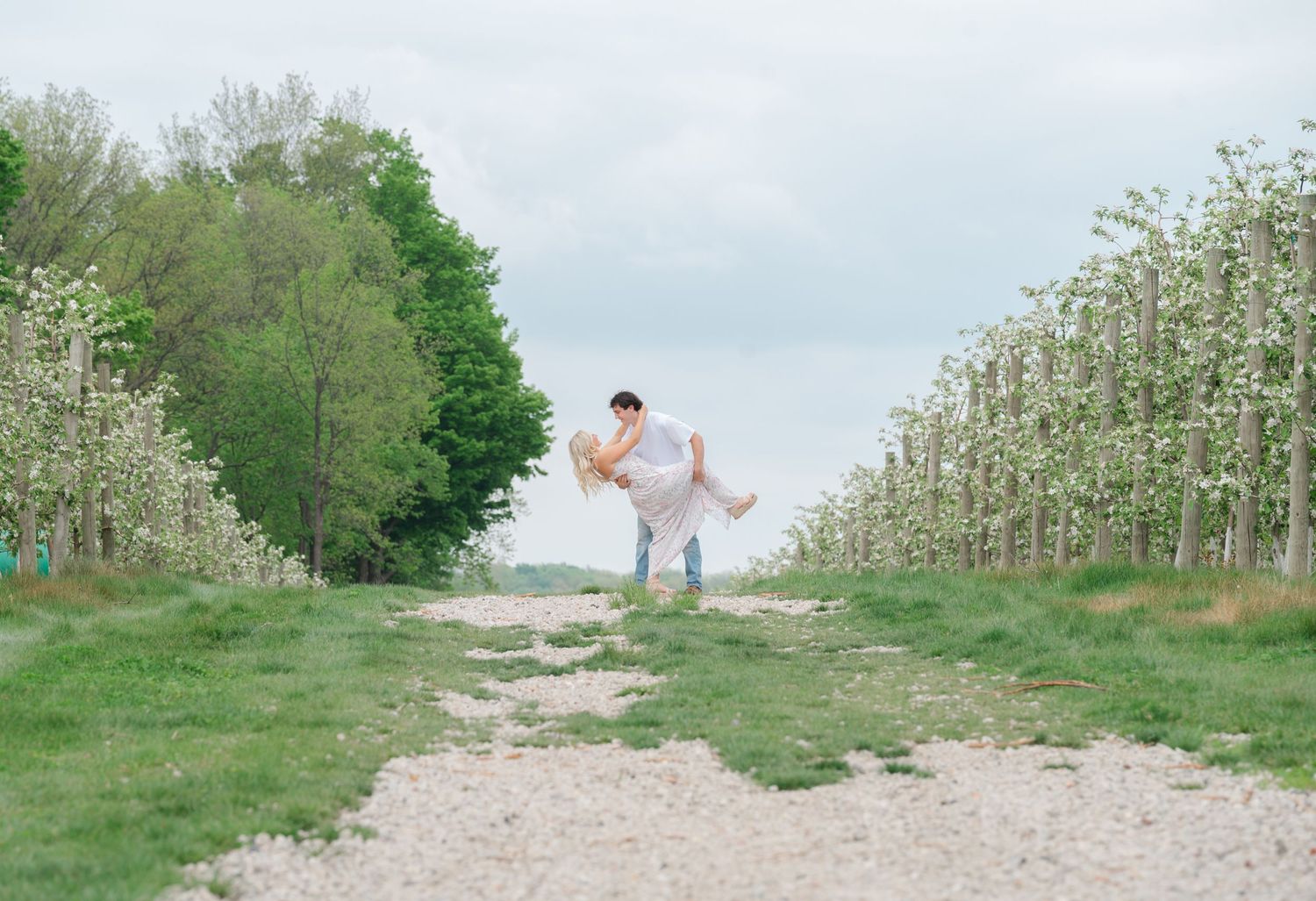 groom dipping bride going down aisle way