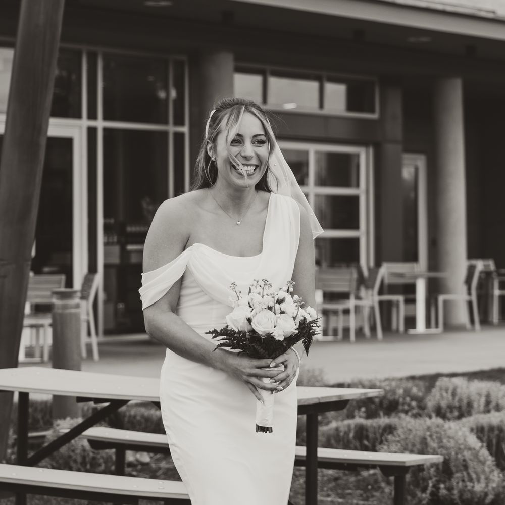 smiling bride walking during ceremony at kelowna winery