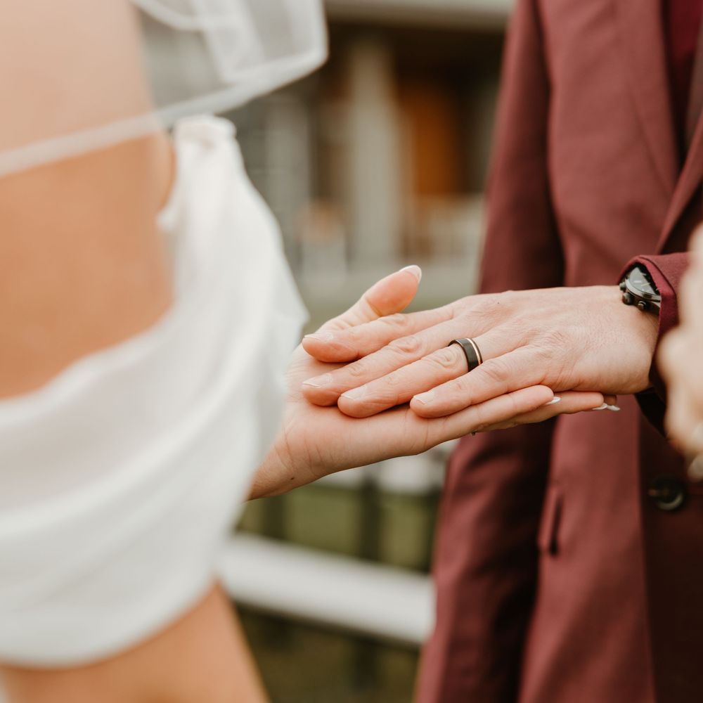 bride holding grooms hand at kelowna elopement