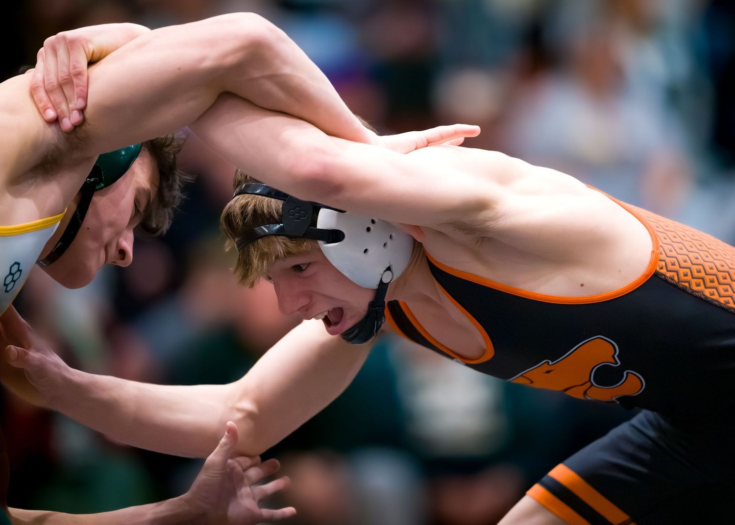 Palmyra wrestler grapples with a Central Dauphin wrestler during a match by Deanna Fox, SportsFox Photography based in Hershey, PA.