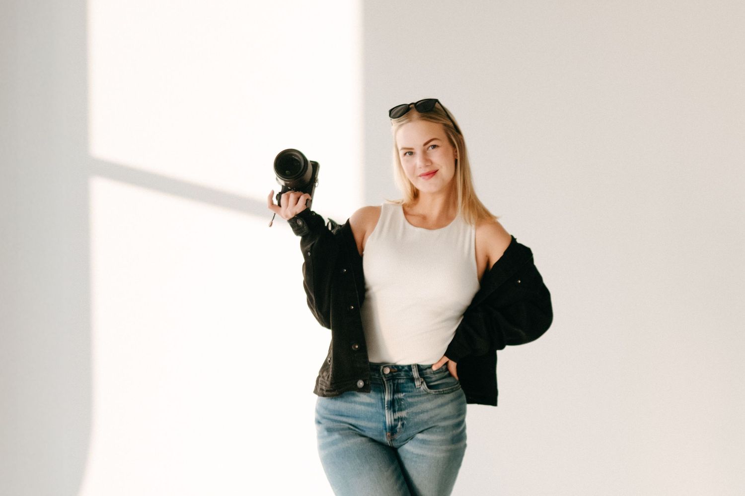 Woman posing confidently and showing her personality during a professional studio branding shoot.