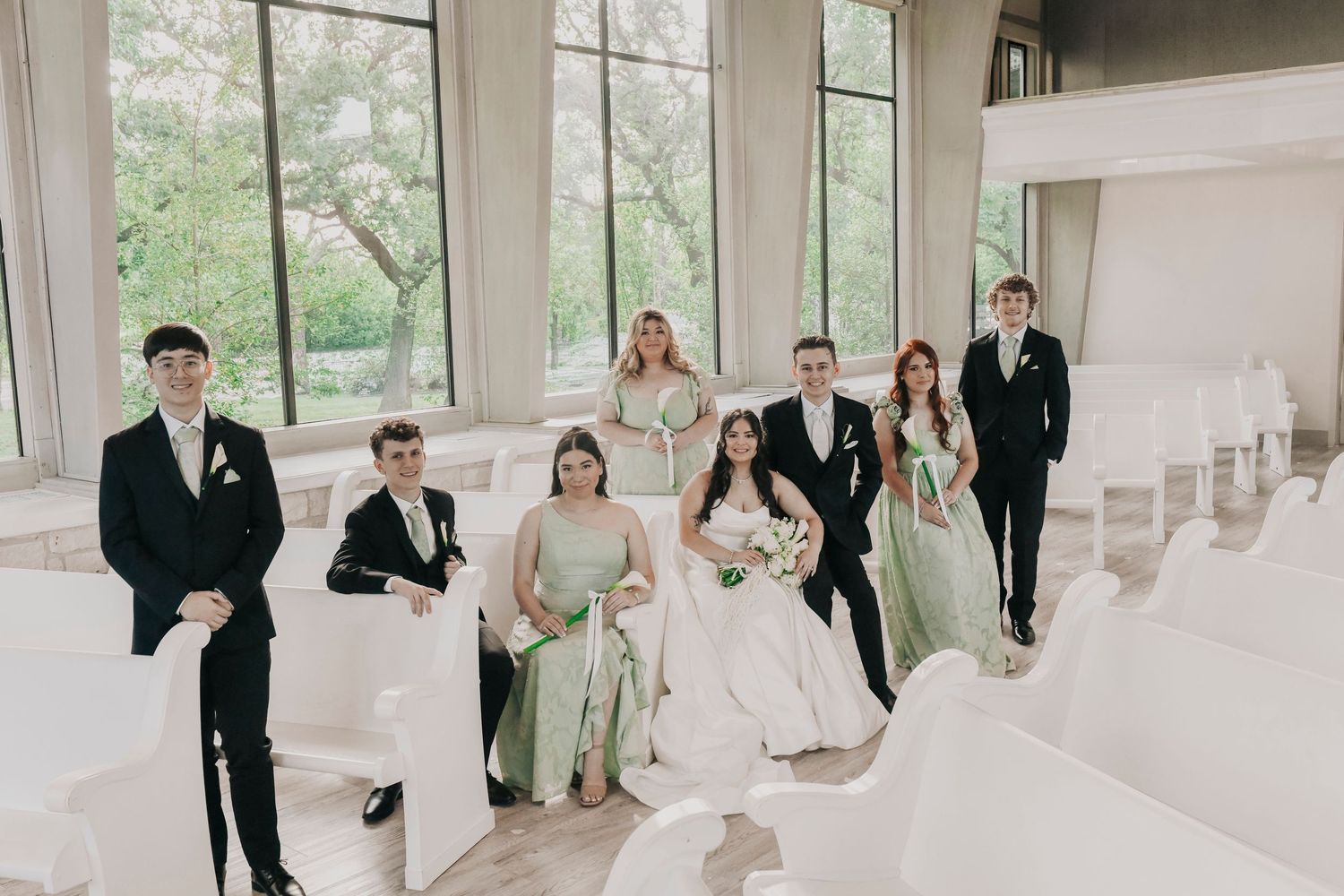 Bride and groom surrounded by loved ones after exchanging vows