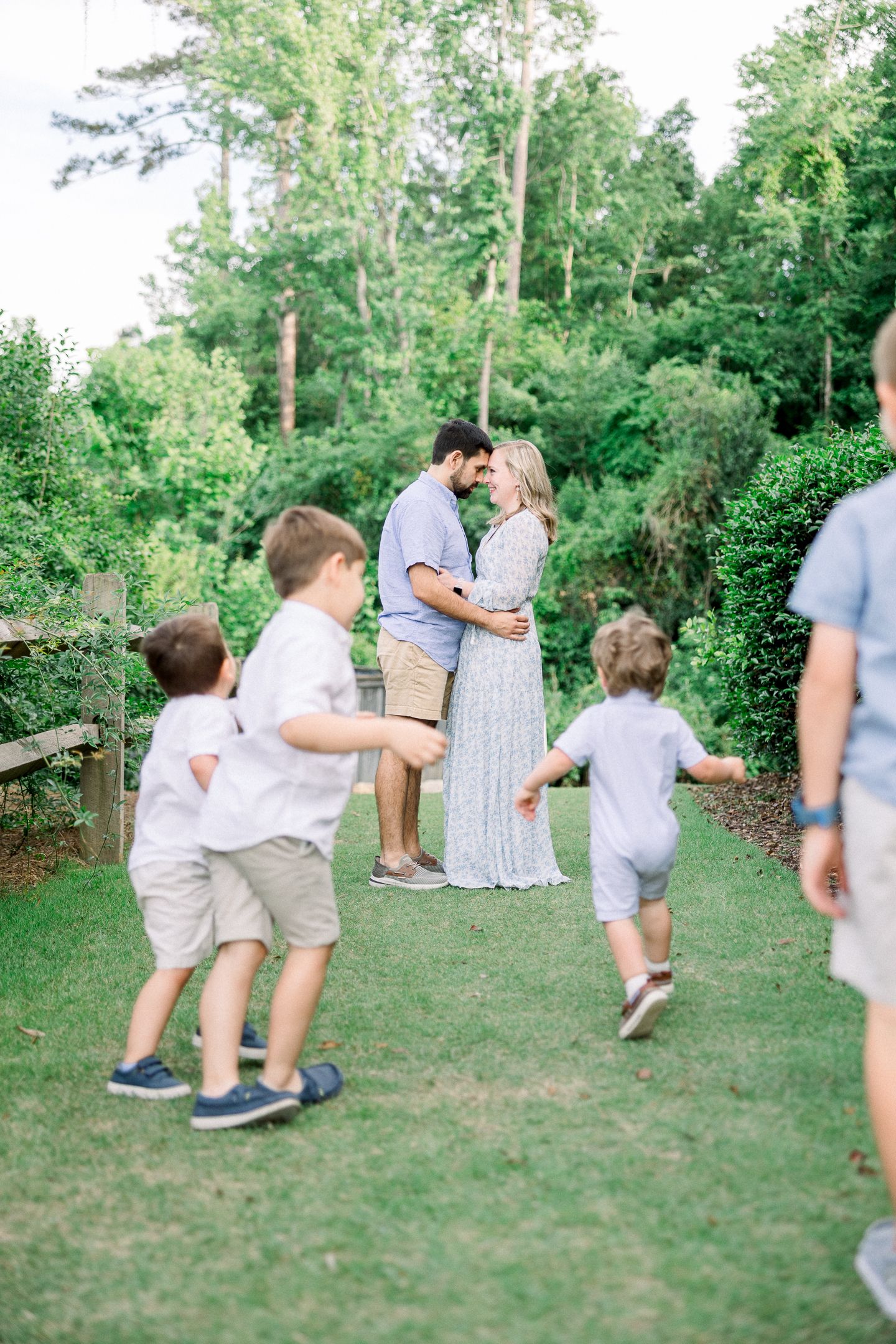 Augusta family photographer capturing candid moment with parents and four boys