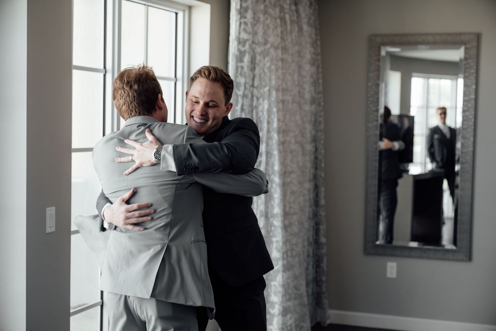 A series of progressive photos showing a joyful reunion embrace in a bright modern room.