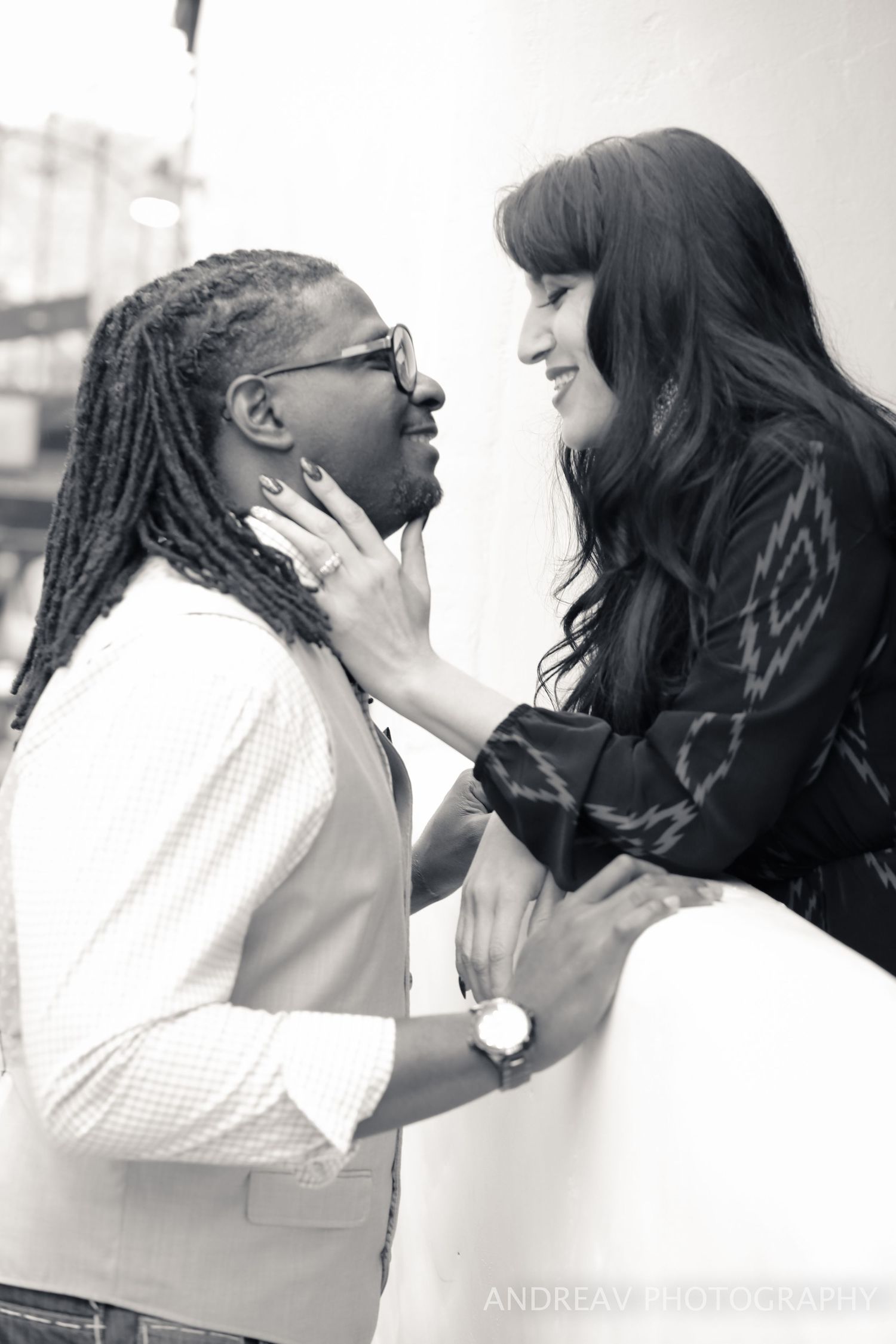 Black and white portrait series showing intimate romantic moments against white background.