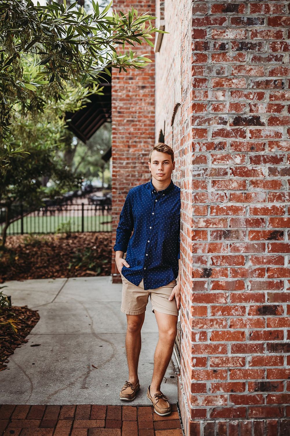 A collage of lifestyle portraits set against a rustic brick column in a garden setting.