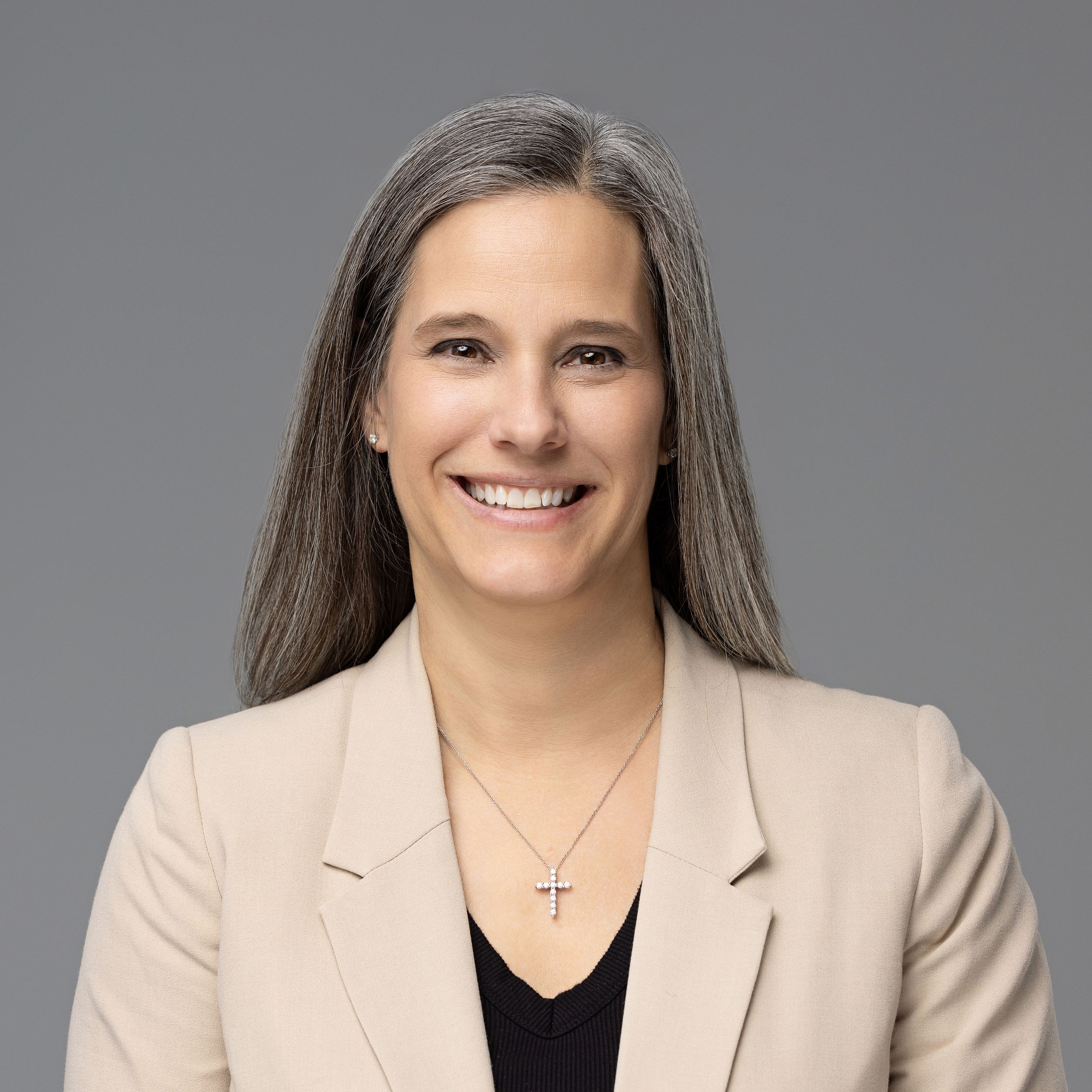 Professional portrait series showing progressively wider shots of a person wearing a beige blazer and black top.