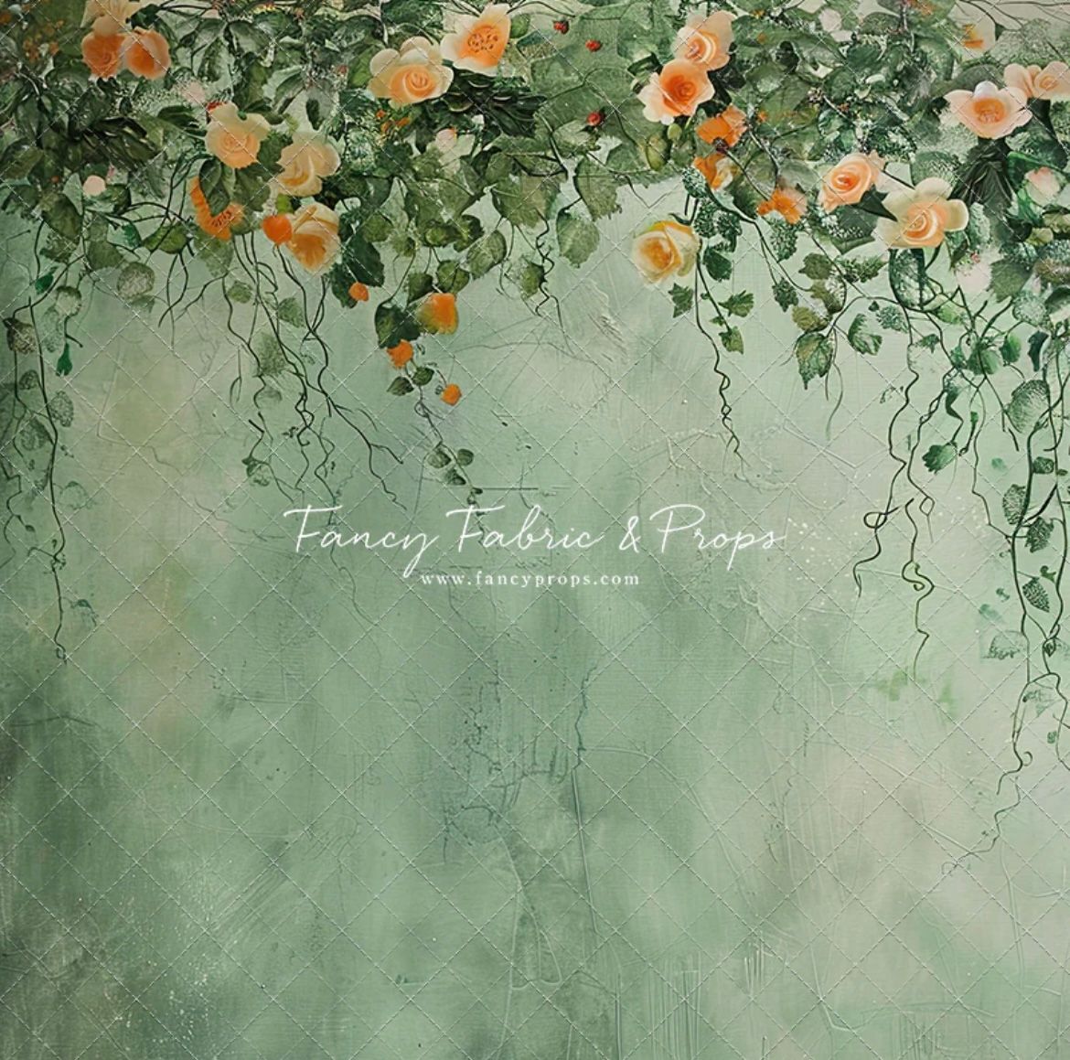 Peach or orange flowers cascading down against a sage green textured backdrop in a romantic garden setting.