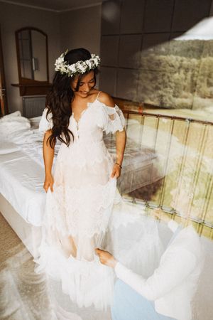 Flowing white wedding dress photographed in an artistic sequence showing movement and detail.
