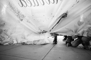 Black and white detail shots of wedding dress layers and movement.