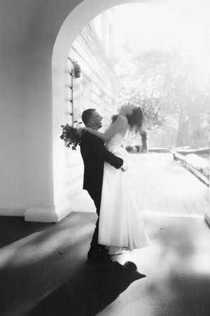 Black and white sequence showing a dancing couple twirling in an elegant space.