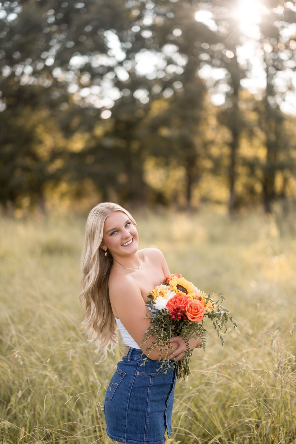 A series of photos in a field at sunset with warm golden light and wildflowers.