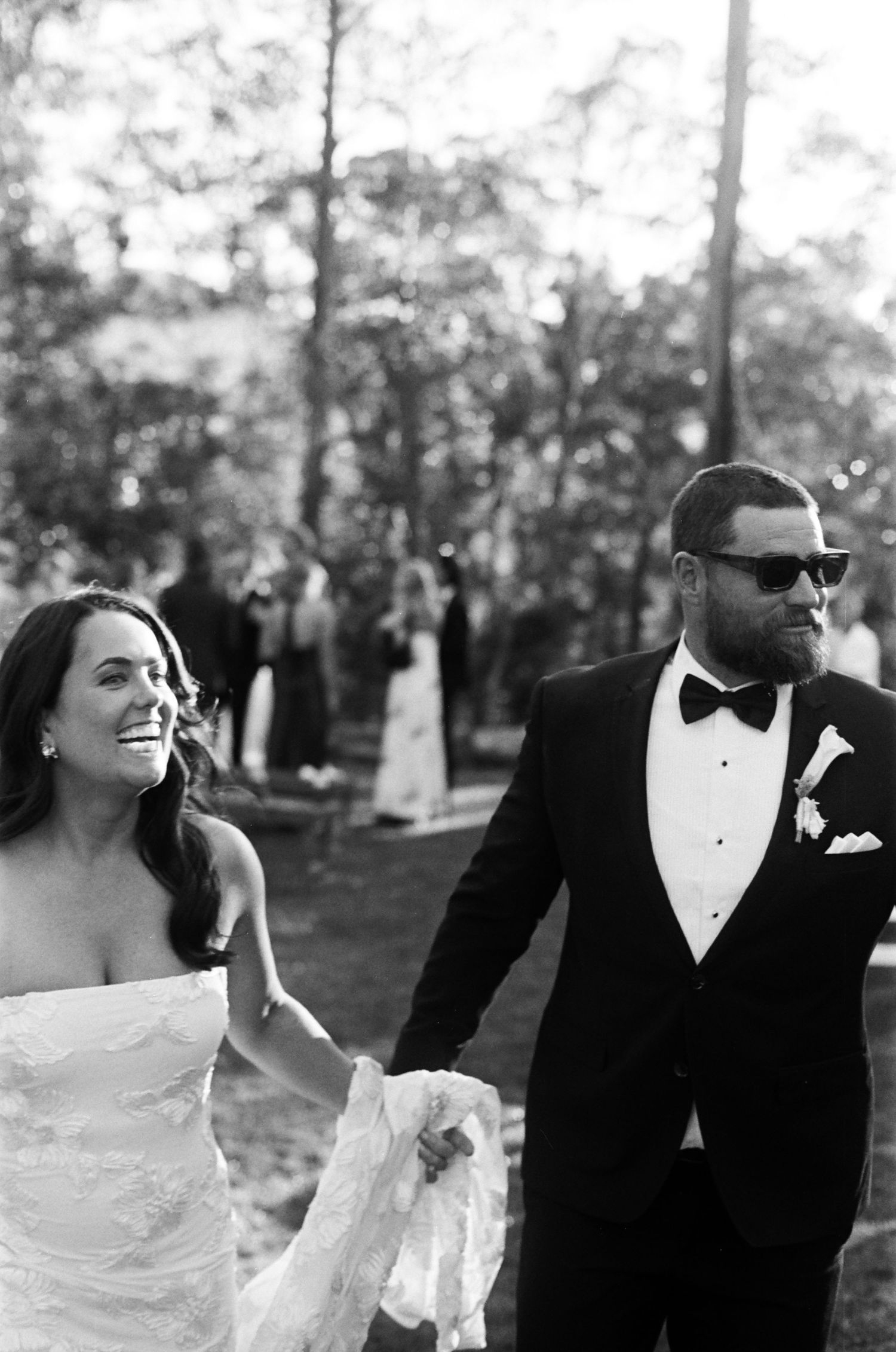Stylish black and white wedding portrait sequence in an outdoor setting.