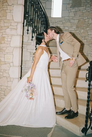 A series of shots showing the hem of a white wedding dress and formal shoes on stone stairs.