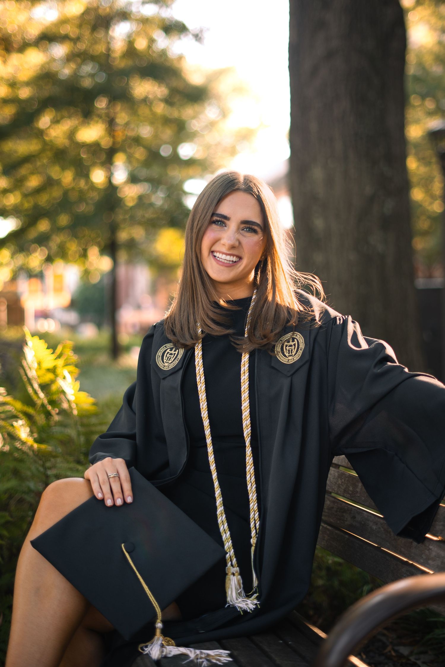 Smiling graduate poses for the best Atlanta grad photos at Georgia Tech with portraits by Pierre The Pear Photography