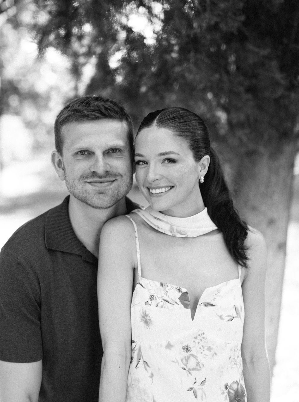 A black and white photo collage showing a couple in casual attire sharing intimate moments outdoors.