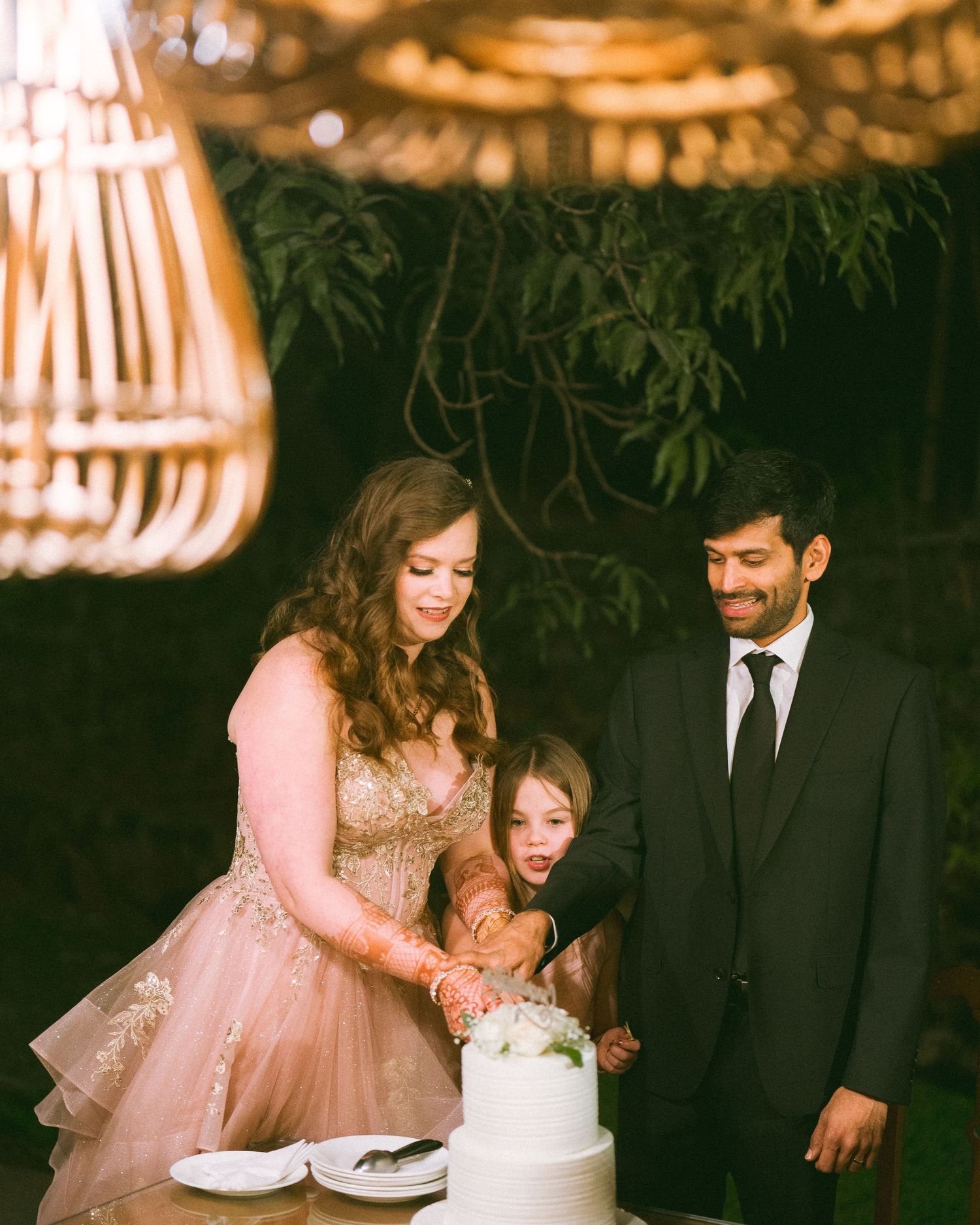 Couple sharing a sweet moment at a wedding reception with elegant decor by the best wedding photographer in London & Birmingham.