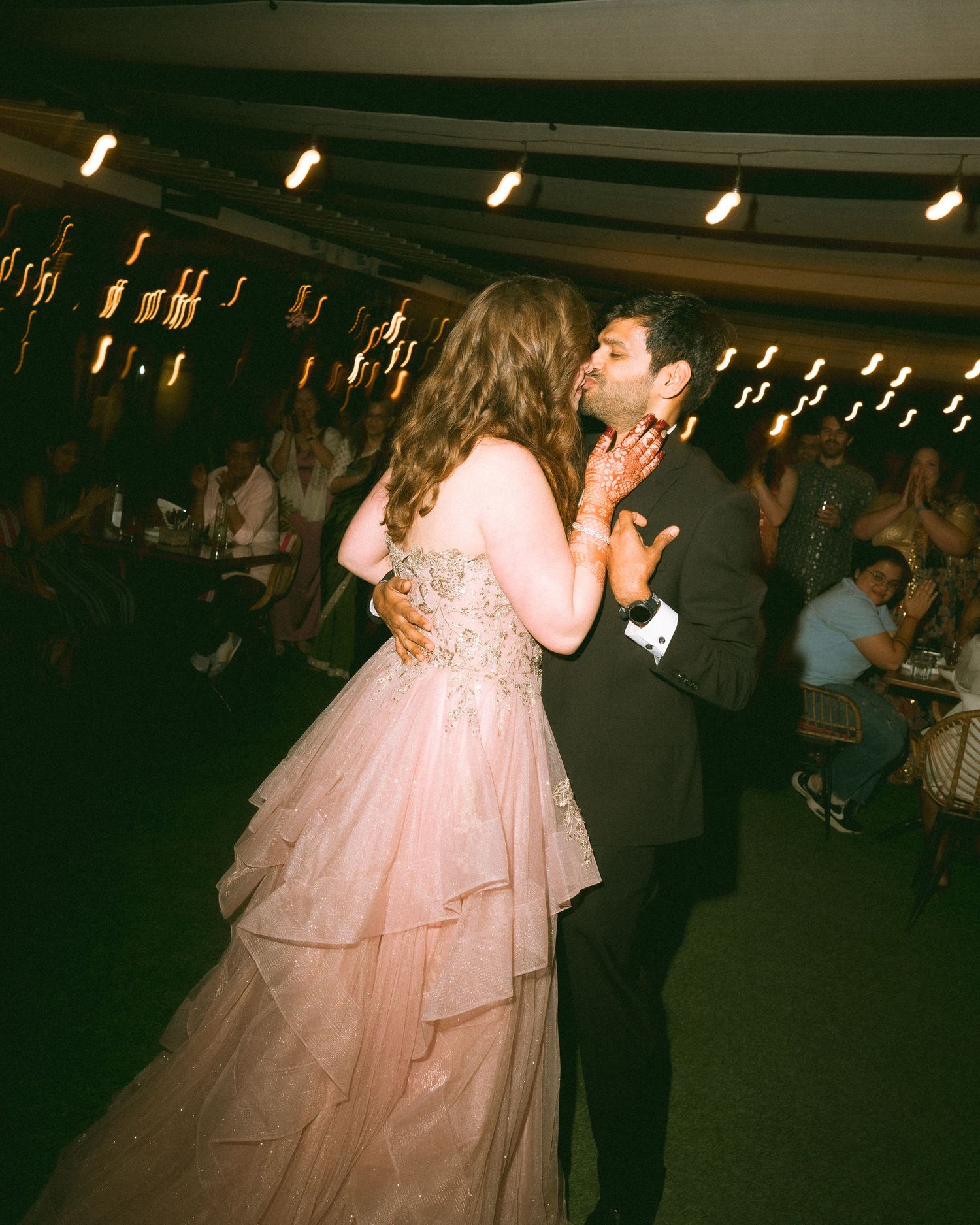 Couple sharing an intimate dance moment at their wedding reception by a wedding photographer in London & Birmingham.