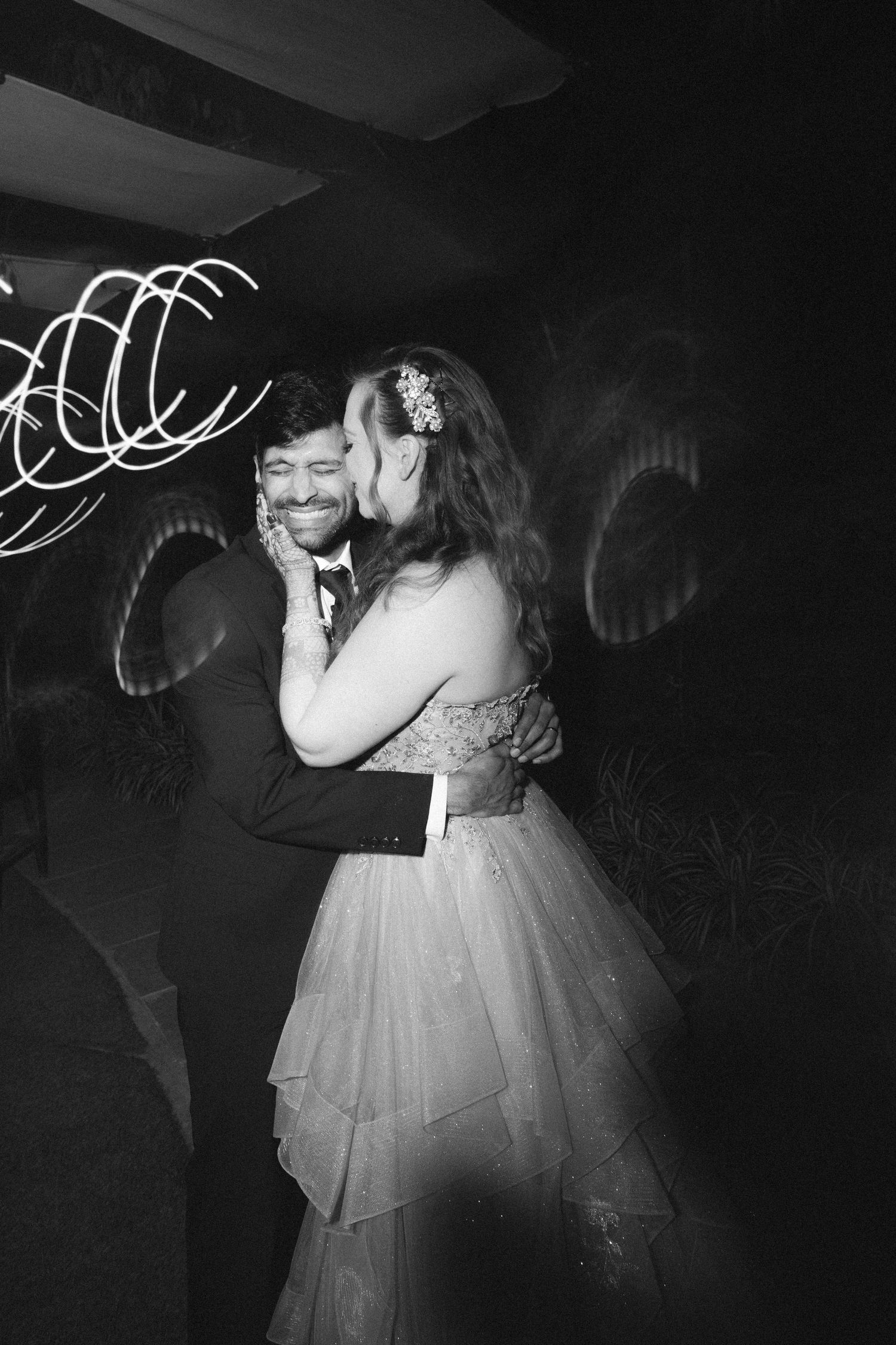 Couple sharing a romantic dance moment at their wedding reception by a wedding photographer in London & Birmingham.