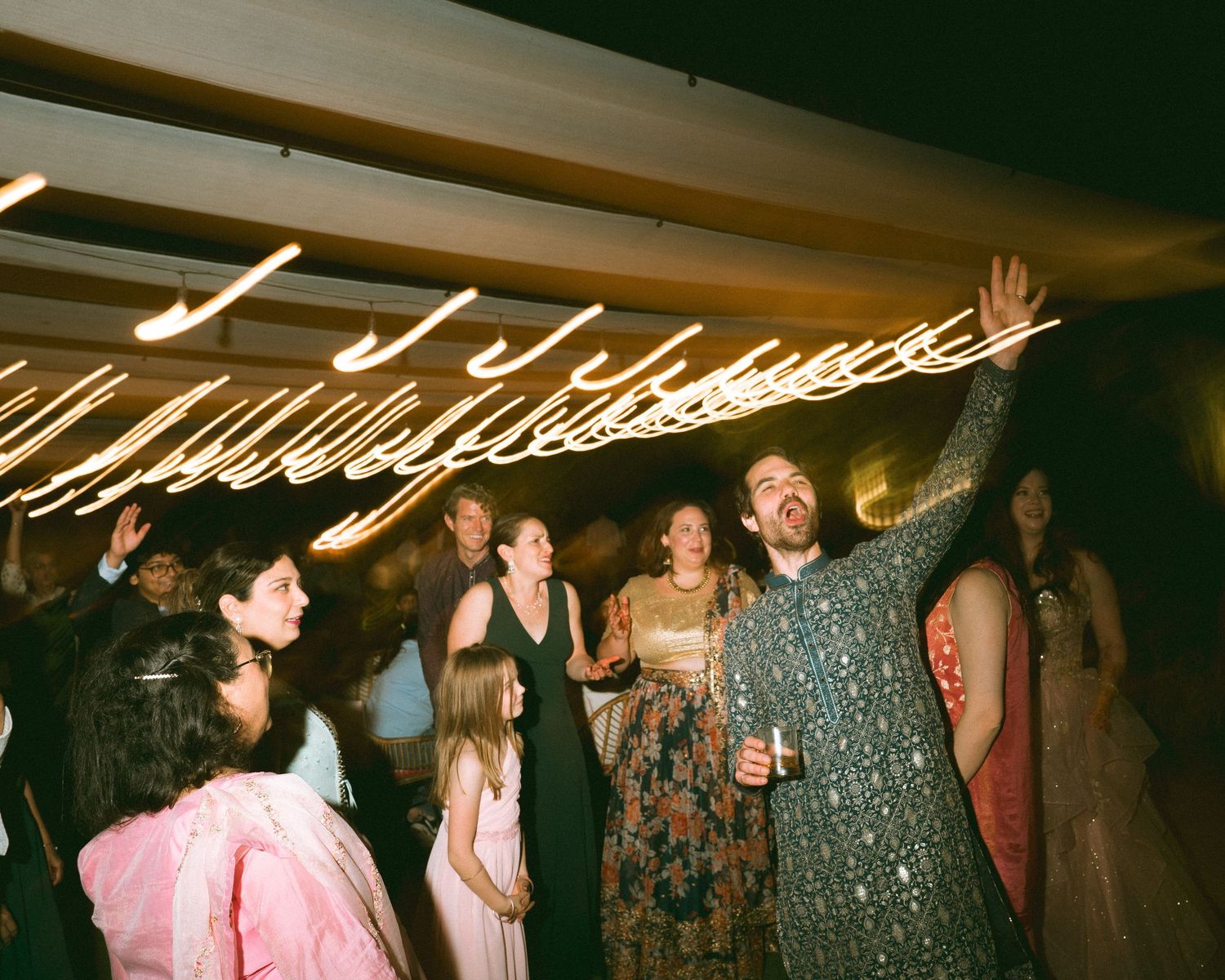 Thought processBlack & white wedding reception shot of guests dancing energetically by a wedding photographer in London & Birmingham