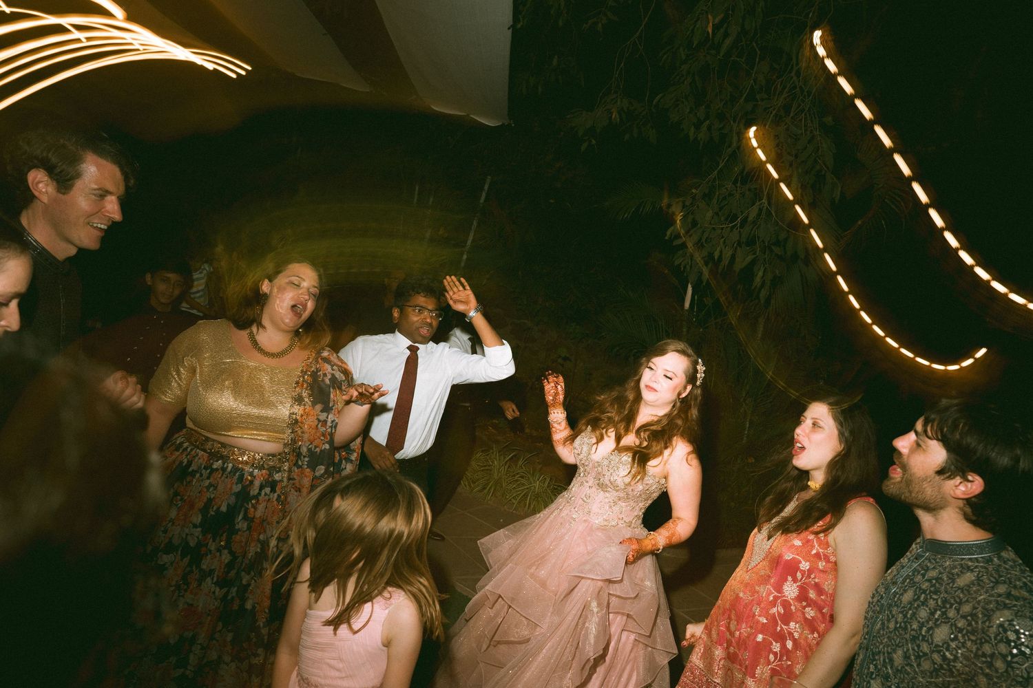 Thought processBlack & white wedding reception shot of guests dancing energetically by a wedding photographer in London & Birmingham