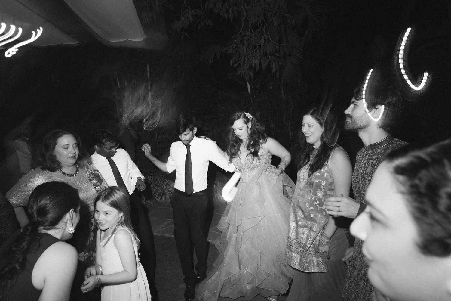 Thought processBlack & white wedding reception shot of guests dancing energetically by a wedding photographer in London & Birmingham