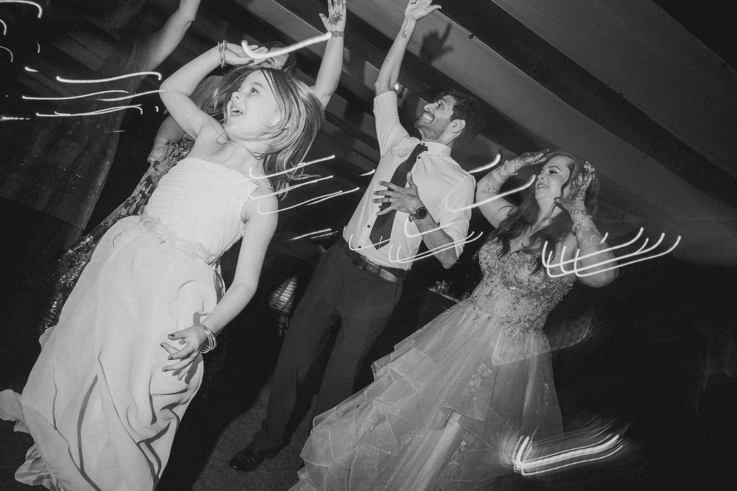 Thought processBlack & white wedding reception shot of guests dancing energetically by a wedding photographer in London & Birmingham