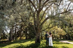 couple under orchid tree on their wedding day