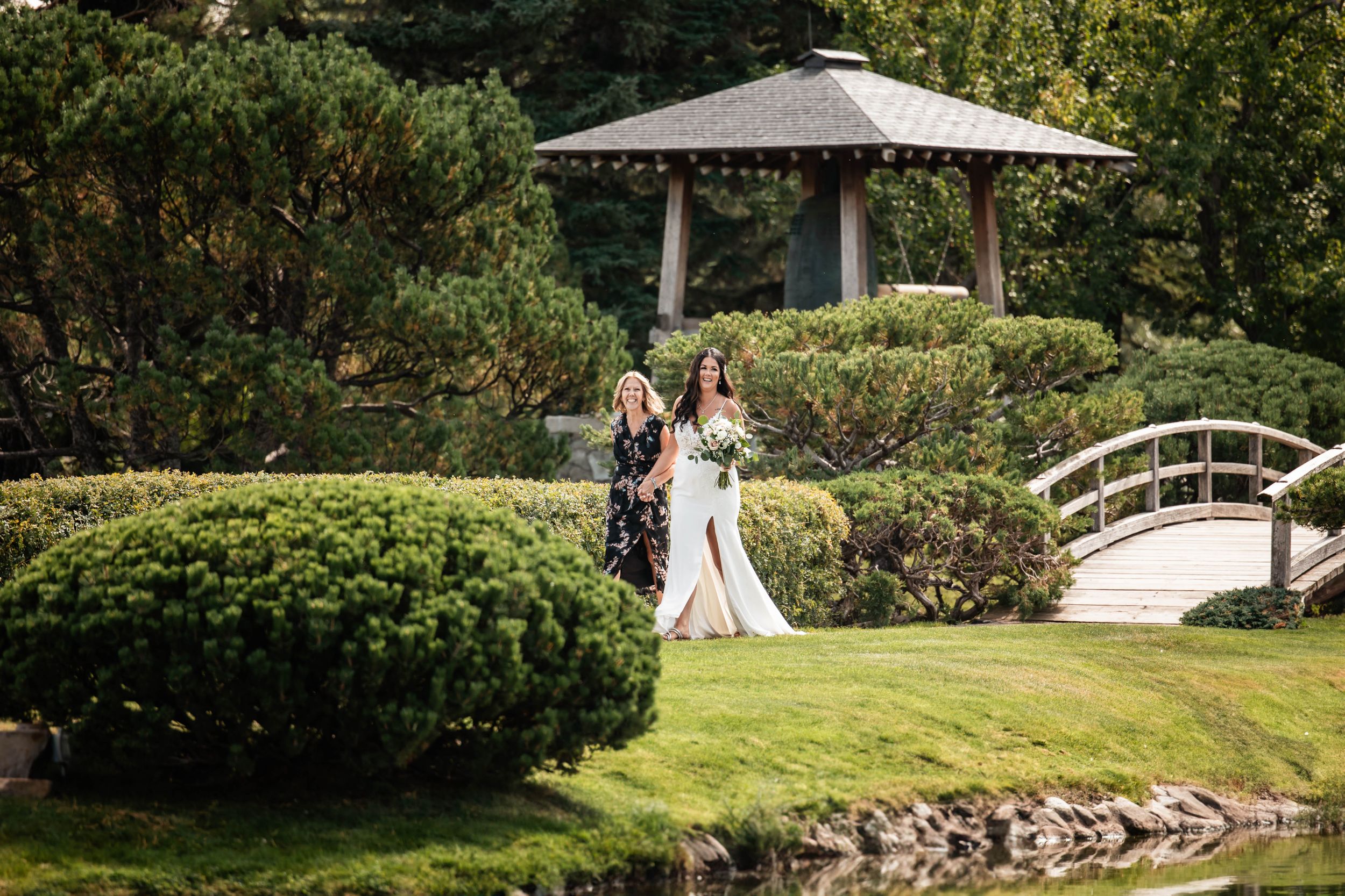 bride walking down the aisle with her mom