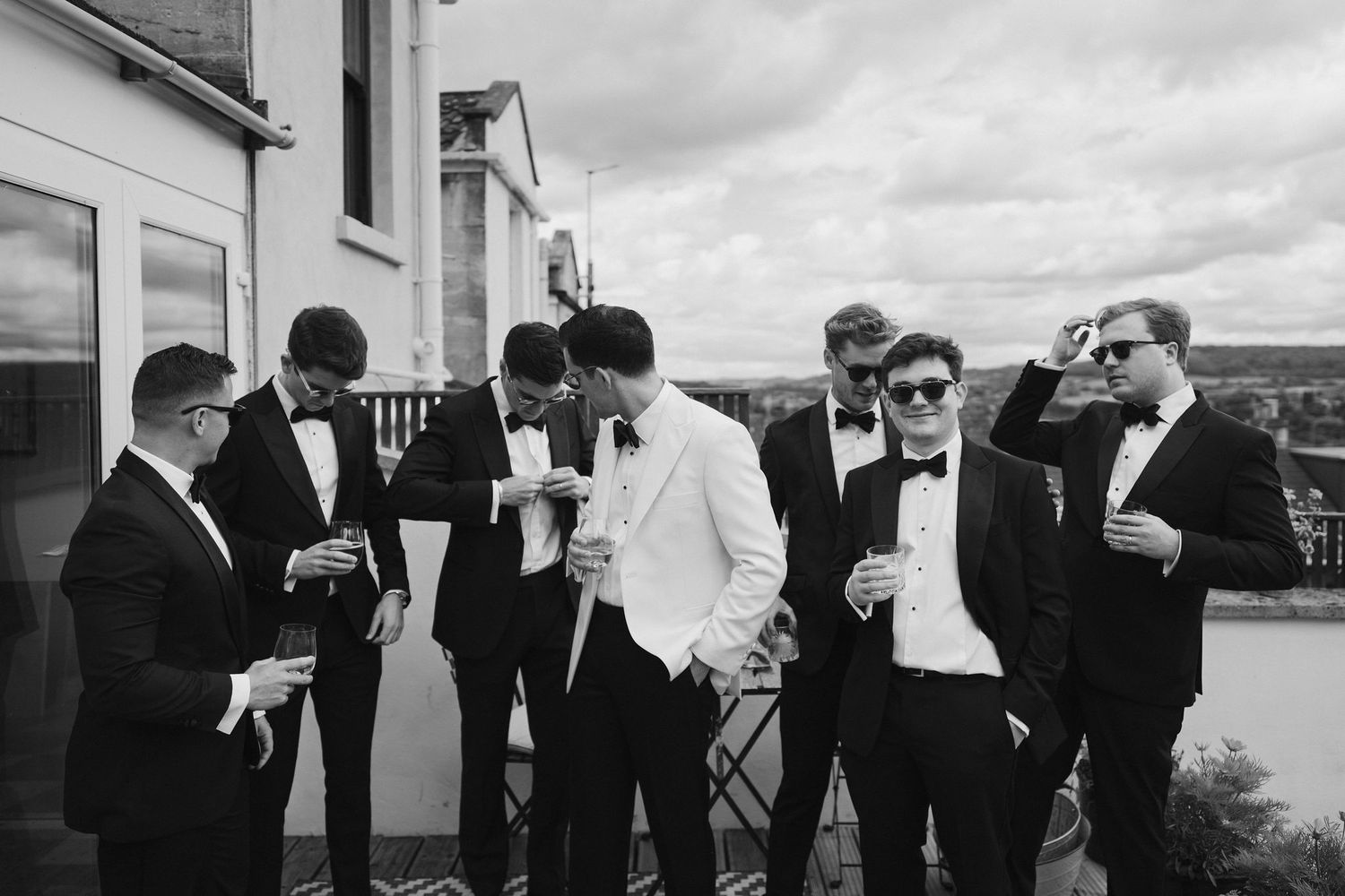 groom and groomsmen enjoying a drink before wedding at hamswell house in bath